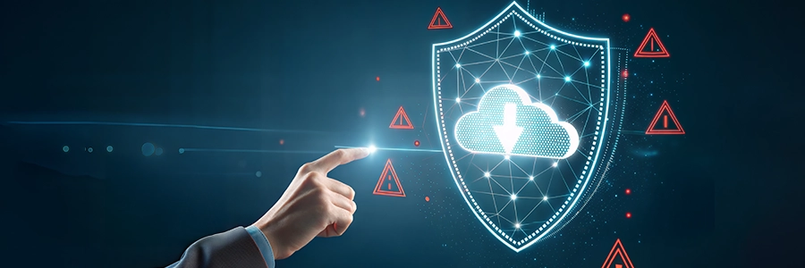 Hand pointing at a glowing shield with a cloud icon, surrounded by warning symbols, representing data security.